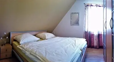 Ein Bett oder Betten in einem Zimmer der Unterkunft Buchenpark Wo 3