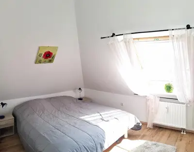 Ein Bett oder Betten in einem Zimmer der Unterkunft Buchenpark Wo 3