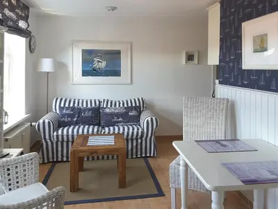 Ein Sitzbereich in der Unterkunft Kapitänshaus Mühlenpark Haus 6 Wo 26