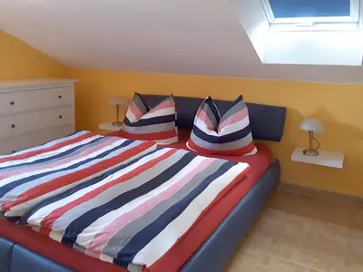 Ein Bett oder Betten in einem Zimmer der Unterkunft Kapitänshaus Mühlenpark Haus 6 Wo 26