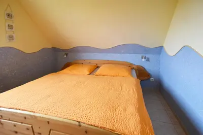 Ein Bett oder Betten in einem Zimmer der Unterkunft Strandläufer