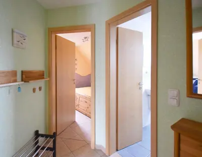 Ein Bett oder Betten in einem Zimmer der Unterkunft Strandläufer