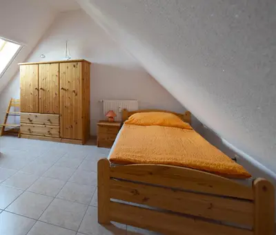 Ein Bett oder Betten in einem Zimmer der Unterkunft Strandläufer