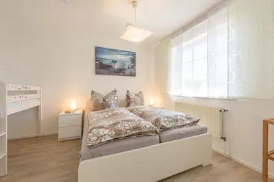 Ein Bett oder Betten in einem Zimmer der Unterkunft Windjammer Wo 6