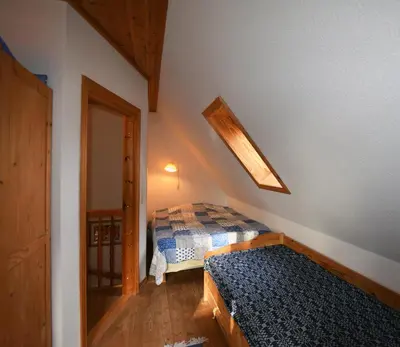 Ein Bett oder Betten in einem Zimmer der Unterkunft Ferienhaus Zaunkönig