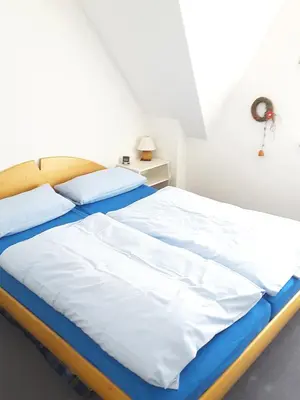 Ein Bett oder Betten in einem Zimmer der Unterkunft Eichenpark Haus 1 Wohnung 5