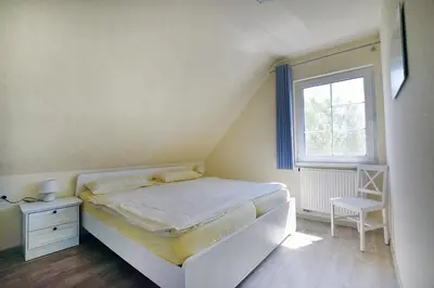 Ein Bett oder Betten in einem Zimmer der Unterkunft Ankerplatz RH 7