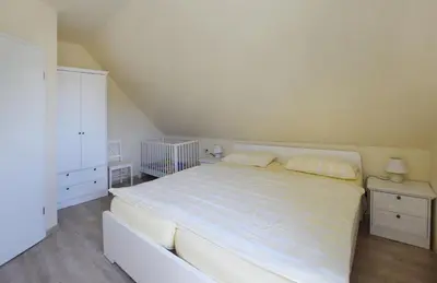 Ein Bett oder Betten in einem Zimmer der Unterkunft Ankerplatz RH 7