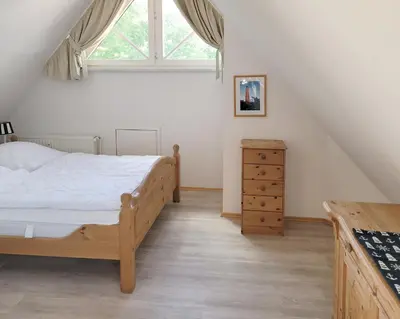 Ein Bett oder Betten in einem Zimmer der Unterkunft Achterdeck