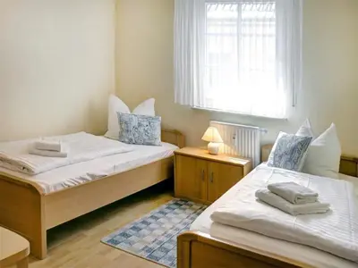 Ein Bett oder Betten in einem Zimmer der Unterkunft Blaue Düne