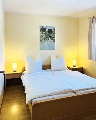 Ein Bett oder Betten in einem Zimmer der Unterkunft Blaue Düne