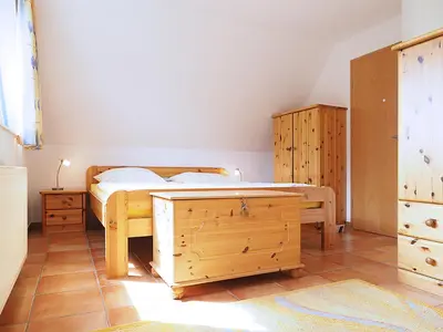 Ein Bett oder Betten in einem Zimmer der Unterkunft Haus Kormoran Wo 5