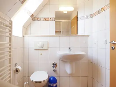 Ein Badezimmer in der Unterkunft Haus Kormoran Wo 5