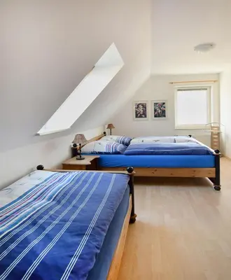 Ein Bett oder Betten in einem Zimmer der Unterkunft Waldstr 7 Wo 6
