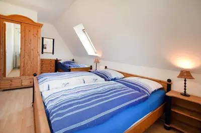 Ein Bett oder Betten in einem Zimmer der Unterkunft Waldstr 7 Wo 6