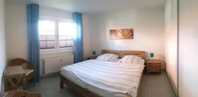 Ein Bett oder Betten in einem Zimmer der Unterkunft Mühlenpark 1 Mühlenpark Haus 2 Wo 5