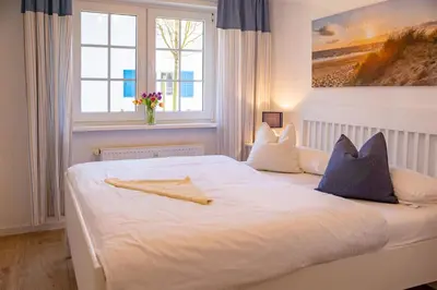 Ein Bett oder Betten in einem Zimmer der Unterkunft Mühlenpark 1 Mühlenpark Haus 5 Wo 17