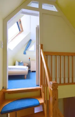 Ein Bett oder Betten in einem Zimmer der Unterkunft Muschelsucher Haus II 4