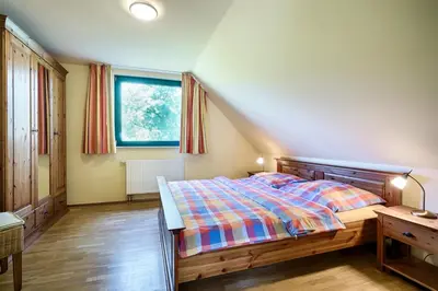 Ein Bett oder Betten in einem Zimmer der Unterkunft Ostseeperle