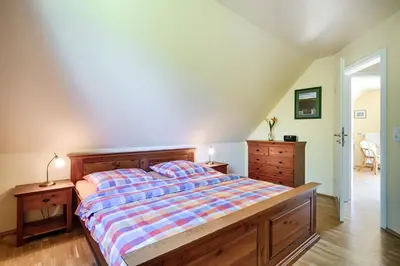 Ein Bett oder Betten in einem Zimmer der Unterkunft Ostseeperle