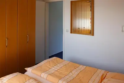 Ein Bett oder Betten in einem Zimmer der Unterkunft Haus am Brunnen Haus 