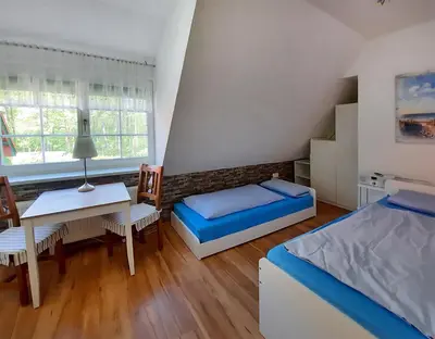 Ein Bett oder Betten in einem Zimmer der Unterkunft Am Wiesengrund Haushälfte 14