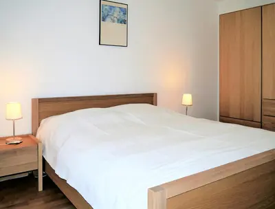 Ein Bett oder Betten in einem Zimmer der Unterkunft Haus 