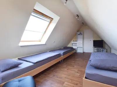 Ein Bett oder Betten in einem Zimmer der Unterkunft Haus am Brunnen Haus 