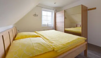Ein Bett oder Betten in einem Zimmer der Unterkunft Im Grünnen Wo 3