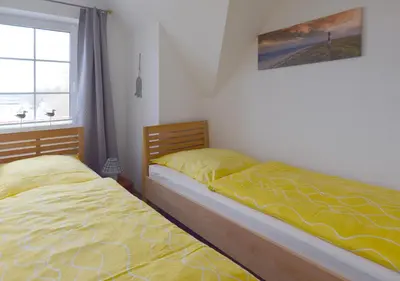 Ein Bett oder Betten in einem Zimmer der Unterkunft Im Grünnen Wo 3