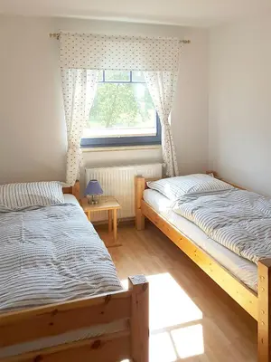 Ein Bett oder Betten in einem Zimmer der Unterkunft Haus Kormoran Wo 4