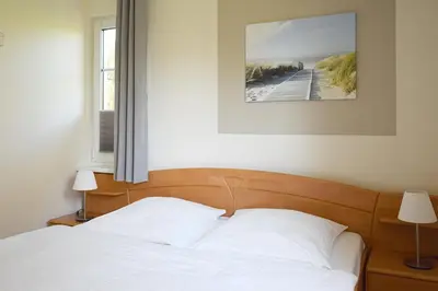 Ein Bett oder Betten in einem Zimmer der Unterkunft Buchengrund Wo 1