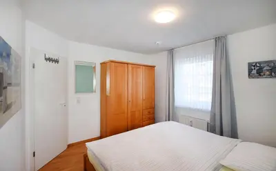 Ein Bett oder Betten in einem Zimmer der Unterkunft Im Grünnen Wo 1