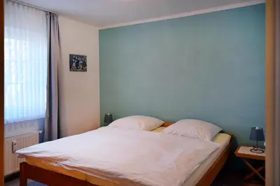 Ein Bett oder Betten in einem Zimmer der Unterkunft Im Grünnen Wo 1