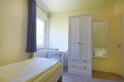 Ein Bett oder Betten in einem Zimmer der Unterkunft Ankerplatz RH 4