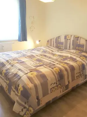 Ein Bett oder Betten in einem Zimmer der Unterkunft Buchenpark Wo 2