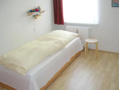 Ein Bett oder Betten in einem Zimmer der Unterkunft Buchenpark Wo 2
