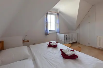Ein Bett oder Betten in einem Zimmer der Unterkunft Haus Albatros Albatros Wo 4