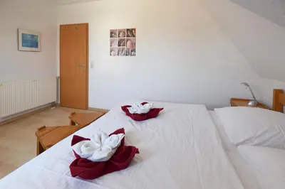 Ein Bett oder Betten in einem Zimmer der Unterkunft Haus Albatros Albatros Wo 4