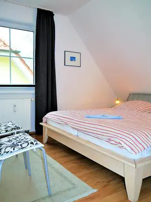 Ein Bett oder Betten in einem Zimmer der Unterkunft Buchenpark Wo 4