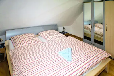 Ein Bett oder Betten in einem Zimmer der Unterkunft Buchenpark Wo 4