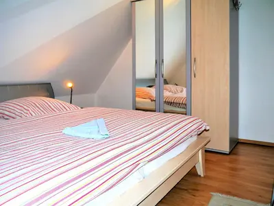 Ein Bett oder Betten in einem Zimmer der Unterkunft Buchenpark Wo 4