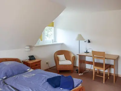 Ein Bett oder Betten in einem Zimmer der Unterkunft Dat Müggenhus in Wieck