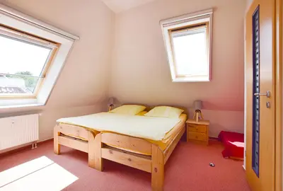 Ein Bett oder Betten in einem Zimmer der Unterkunft Buchenpark Wo 7