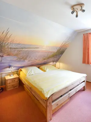 Ein Bett oder Betten in einem Zimmer der Unterkunft Buchenpark Wo 7