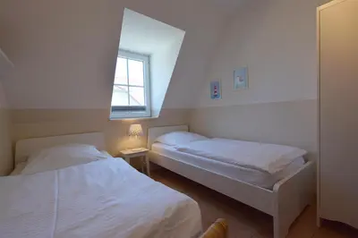Ein Bett oder Betten in einem Zimmer der Unterkunft Haus Albatros Albatros Wo 3