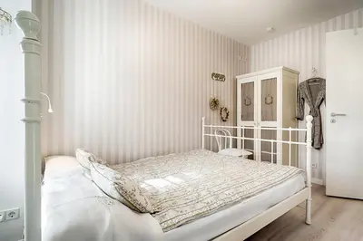 Ein Bett oder Betten in einem Zimmer der Unterkunft Trident Wohnung 1