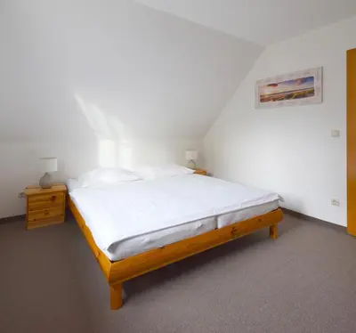 Ein Bett oder Betten in einem Zimmer der Unterkunft FHH 