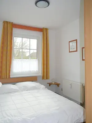 Ein Bett oder Betten in einem Zimmer der Unterkunft Buchengrund Wo 5