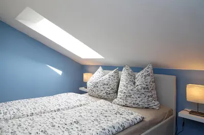Ein Bett oder Betten in einem Zimmer der Unterkunft Kapitänshaus Mühlenpark Haus 6 Wo 25